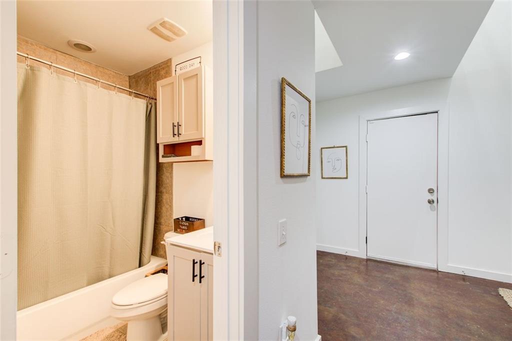 241 Maynard Terrace Southeast, Unit 7 Atlanta, GA 30316 - Photo 4 of 44 a bathroom with a toilet a sink and a shower
