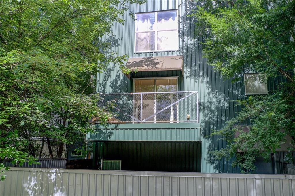 241 Maynard Terrace Southeast, Unit 7 Atlanta, GA 30316 - Photo 41 of 44 a view of a small house with a trees from a balcony