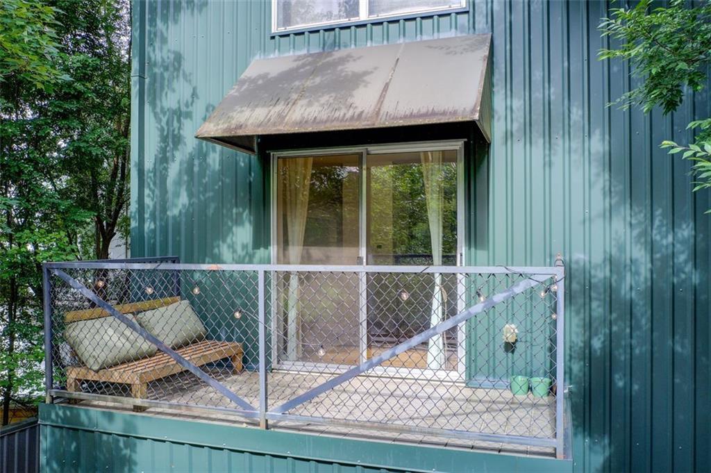 241 Maynard Terrace Southeast, Unit 7 Atlanta, GA 30316 - Photo 42 of 44 a wooden bench sitting in front of a house