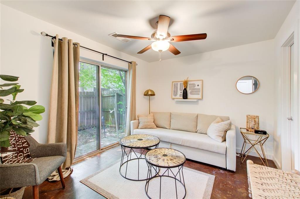 241 Maynard Terrace Southeast, Unit 7 Atlanta, GA 30316 - Photo 6 of 44 a living room with furniture ceiling fan and a window