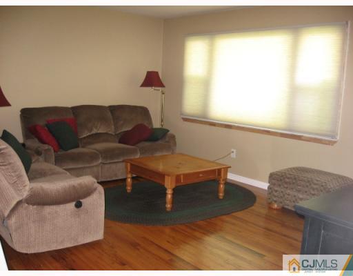 13 Sine Road Edison, NJ 08817 - Photo 2 of 10 a living room with furniture and a window