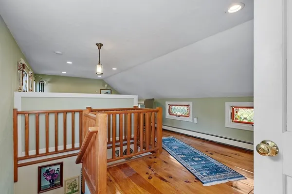 a view of an entryway with wooden floor