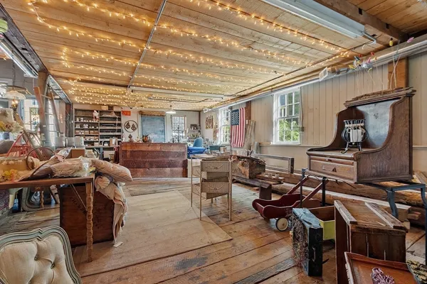 a living room with lots of furniture and a flat screen tv