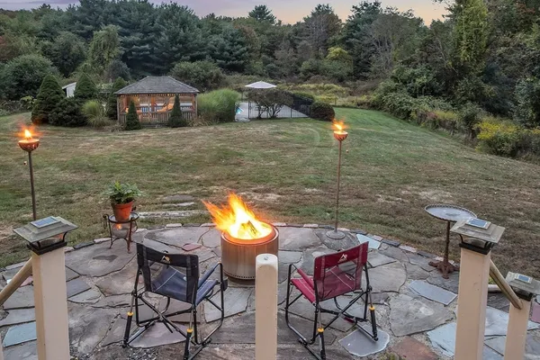 a view of a chairs and table in the patio