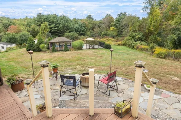 a view of a lake with couches and wooden floor