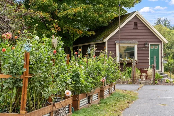 a house with a tree in front of it