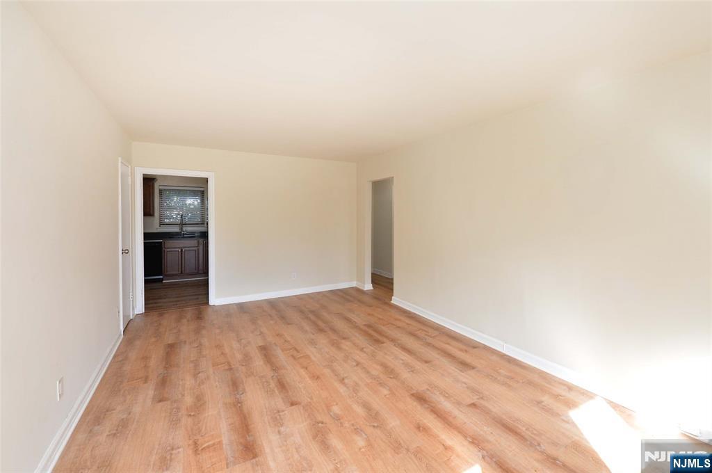 250 Oak Street, Unit E4 Ridgewood, NJ 07450 - Photo 3 of 12 a view of an empty room with wooden floor