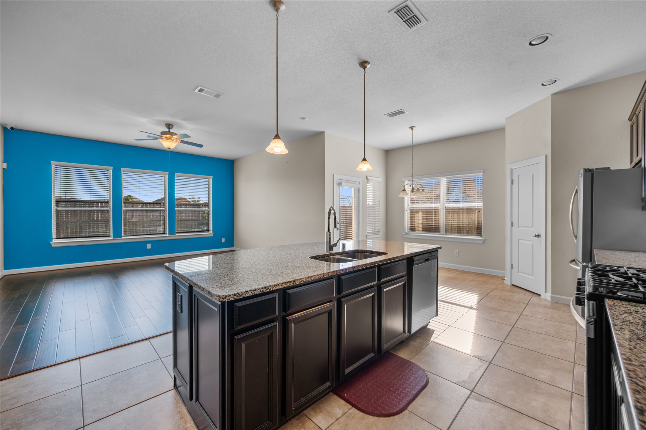 9430 Jayci Hills Lane Cypress, TX 77433 - Photo 11 of 28 a kitchen with stainless steel appliances granite countertop a stove a sink and a refrigerator