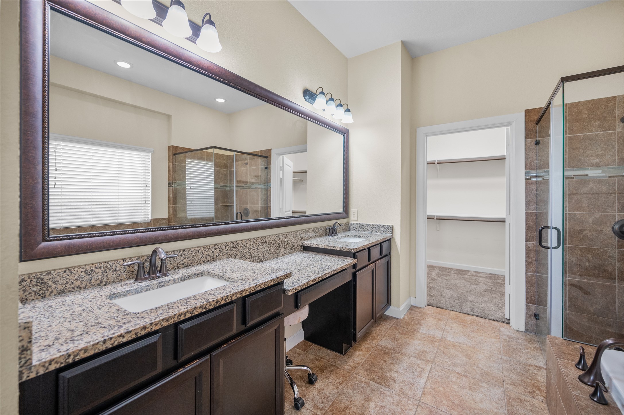 9430 Jayci Hills Lane Cypress, TX 77433 - Photo 17 of 28 a bathroom with a granite countertop sink and a mirror