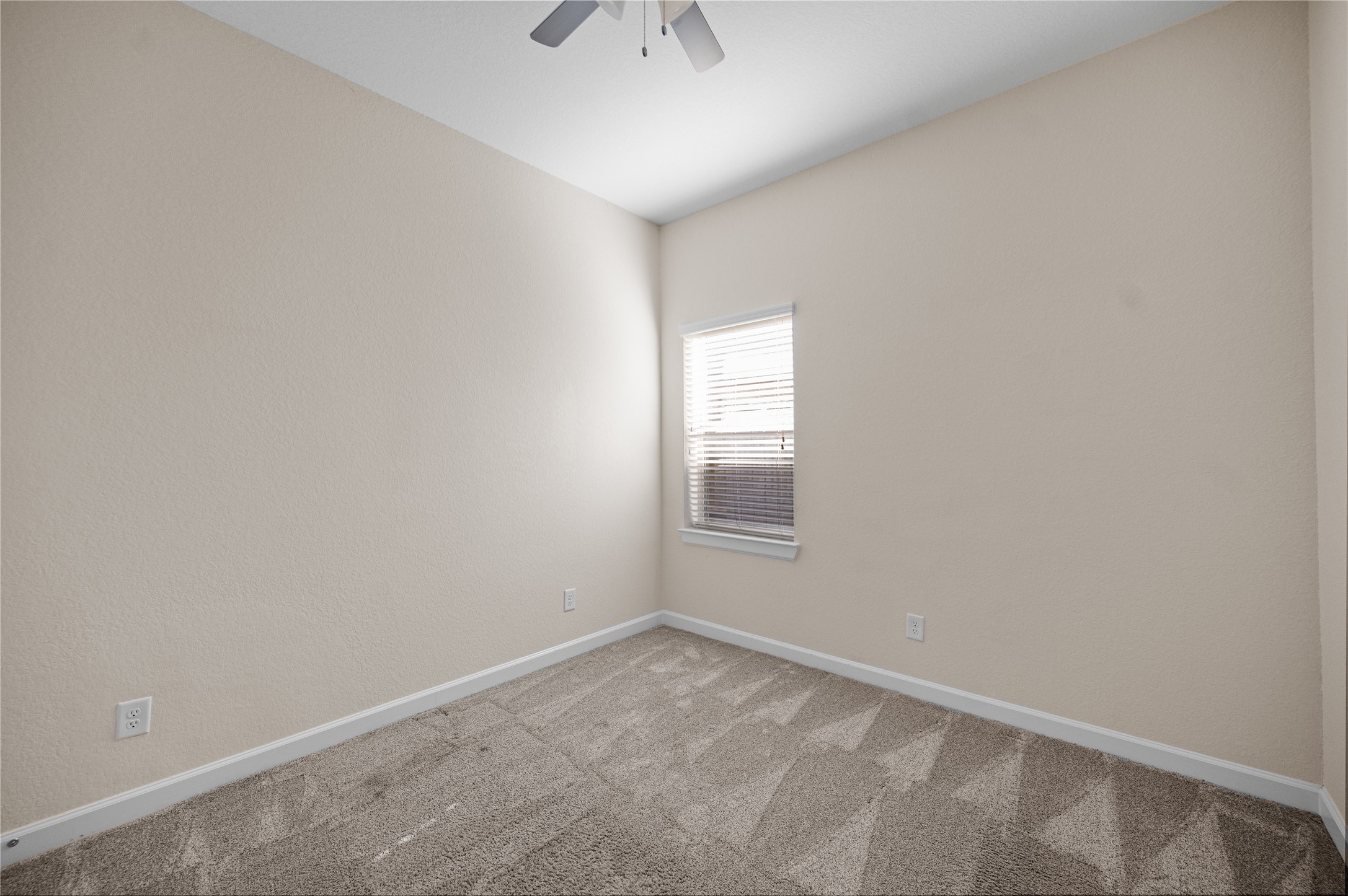 9430 Jayci Hills Lane Cypress, TX 77433 - Photo 21 of 28 an empty room with a window