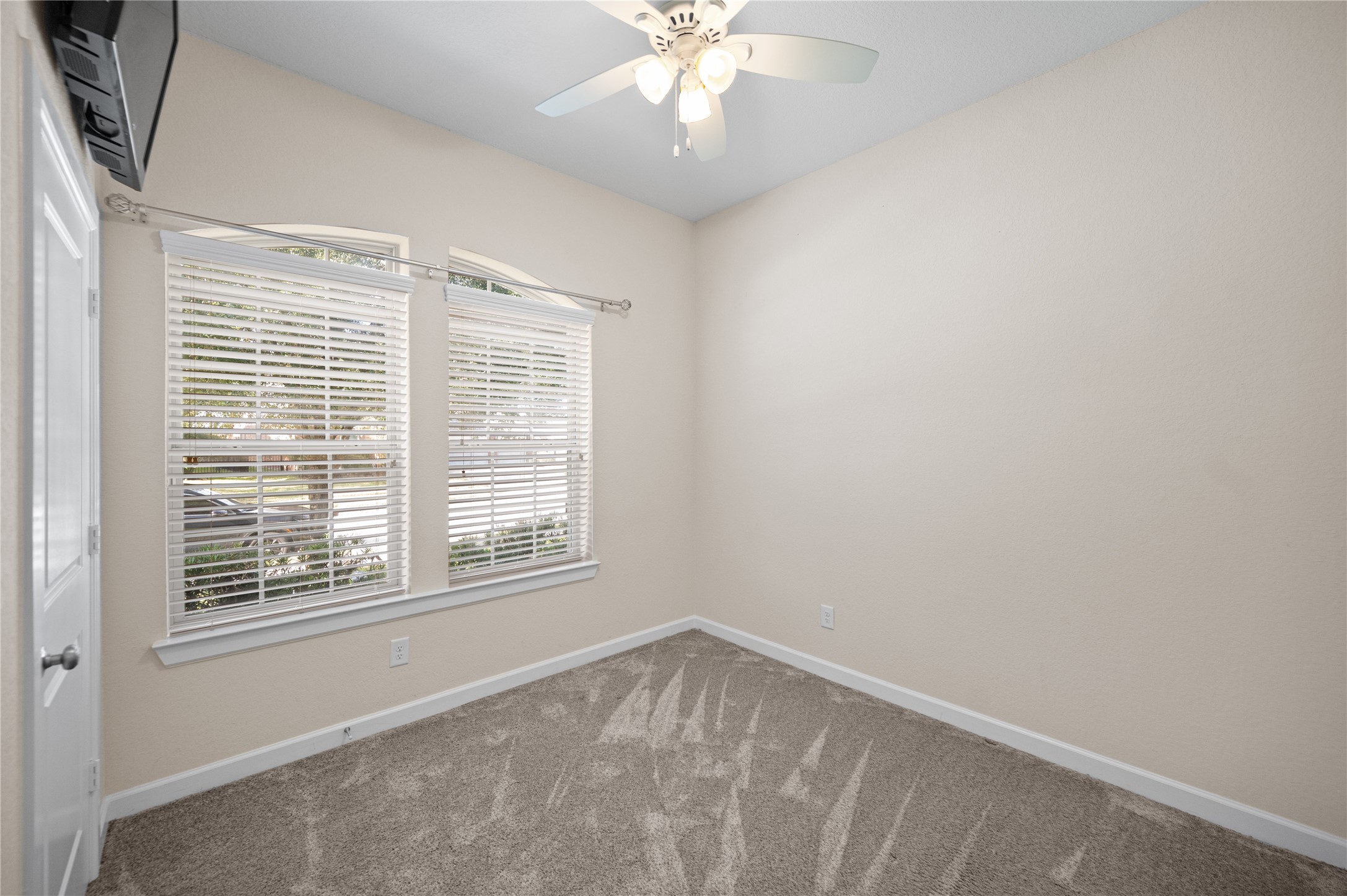 9430 Jayci Hills Lane Cypress, TX 77433 - Photo 24 of 28 a view of an empty room with a window