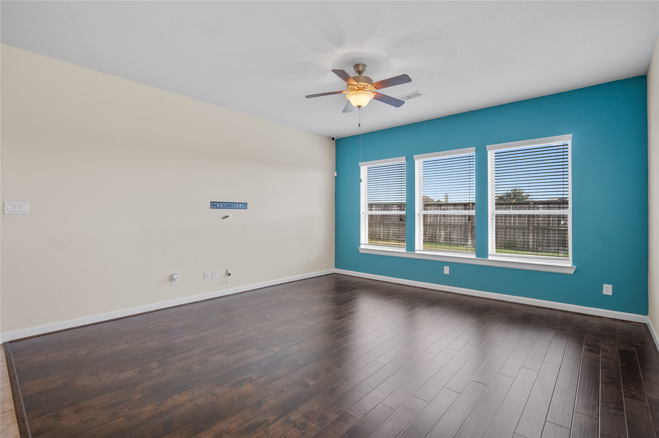 9430 Jayci Hills Lane Cypress, TX 77433 - Photo 9 of 28 a view of wooden floor and windows in a room