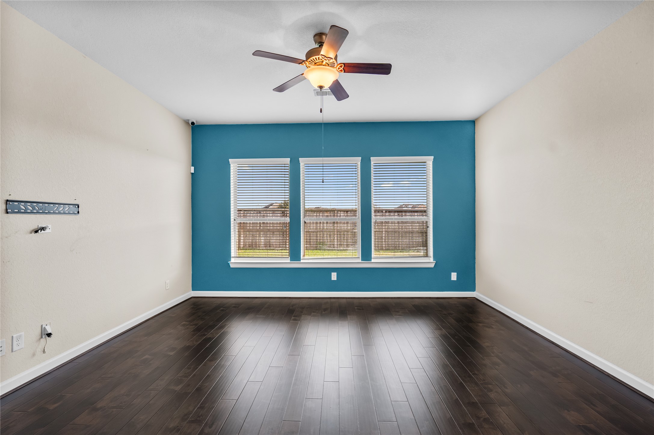 9430 Jayci Hills Lane Cypress, TX 77433 - Photo 10 of 28 an empty room with wooden floor and windows