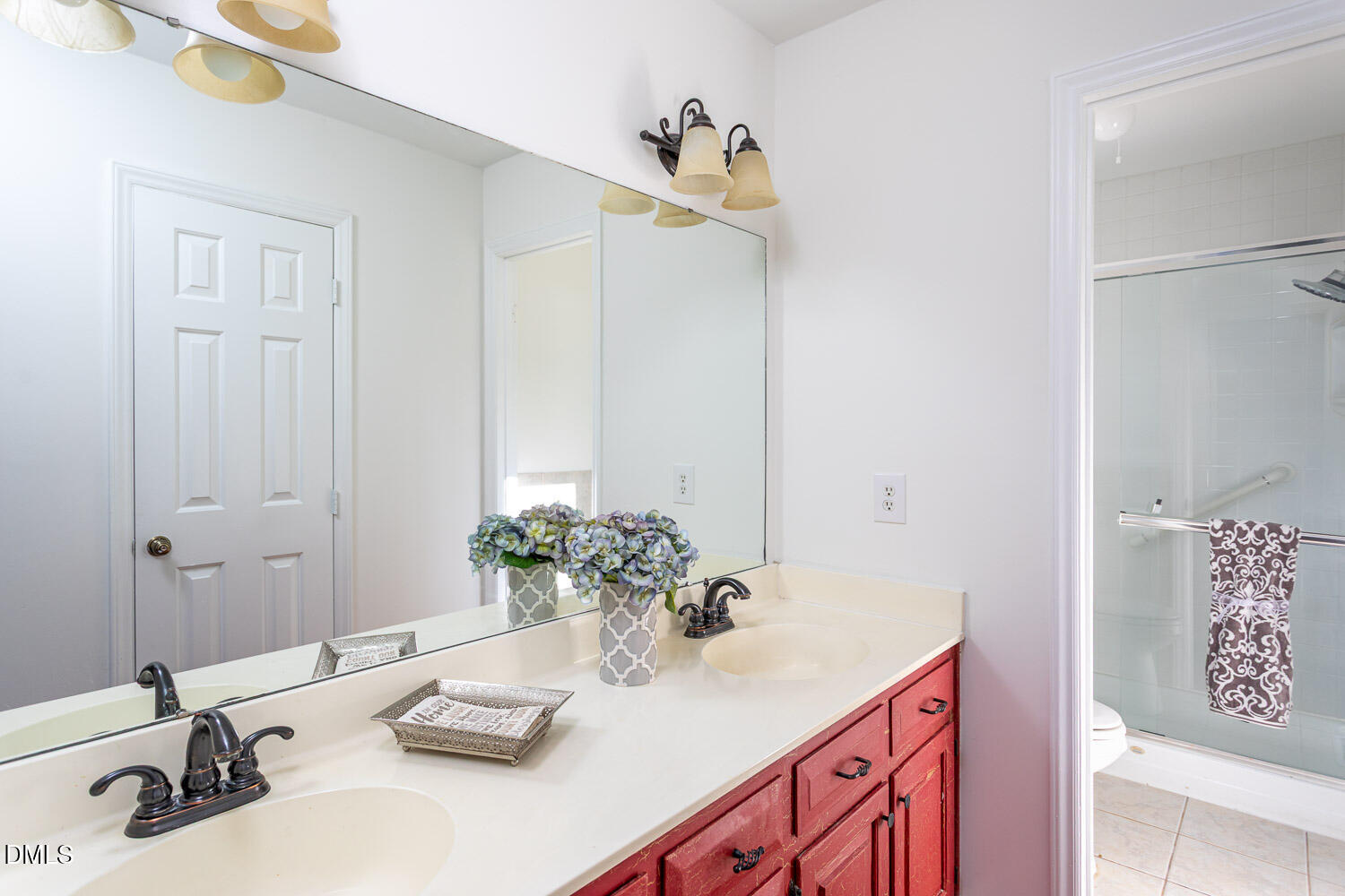 10609 Orchid Lane Raleigh, NC 27603 - Photo 15 of 27 Primary bathroom with dual sinks