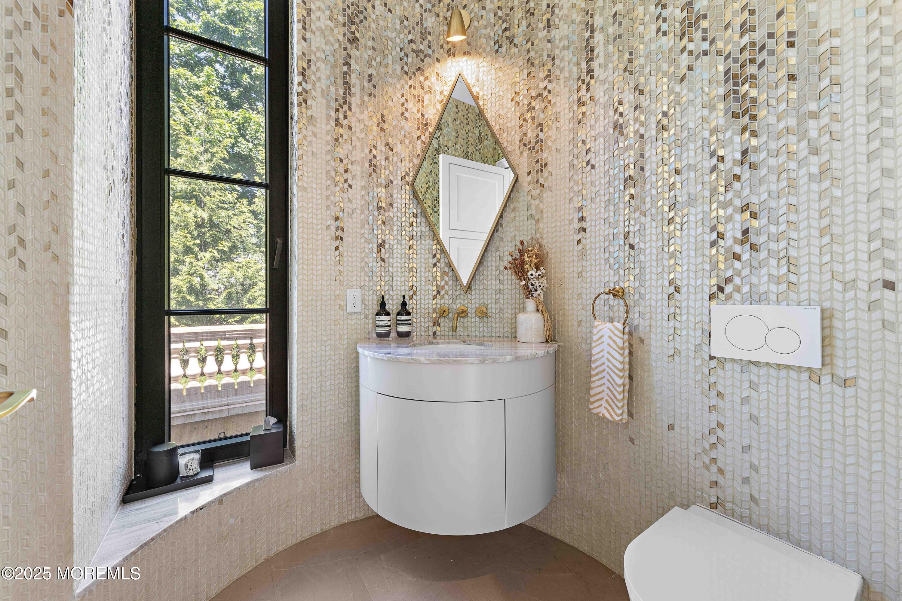 27 Ward Avenue Rumson, NJ 07760 - Photo 21 of 71 a bathroom with a toilet sink and mirror