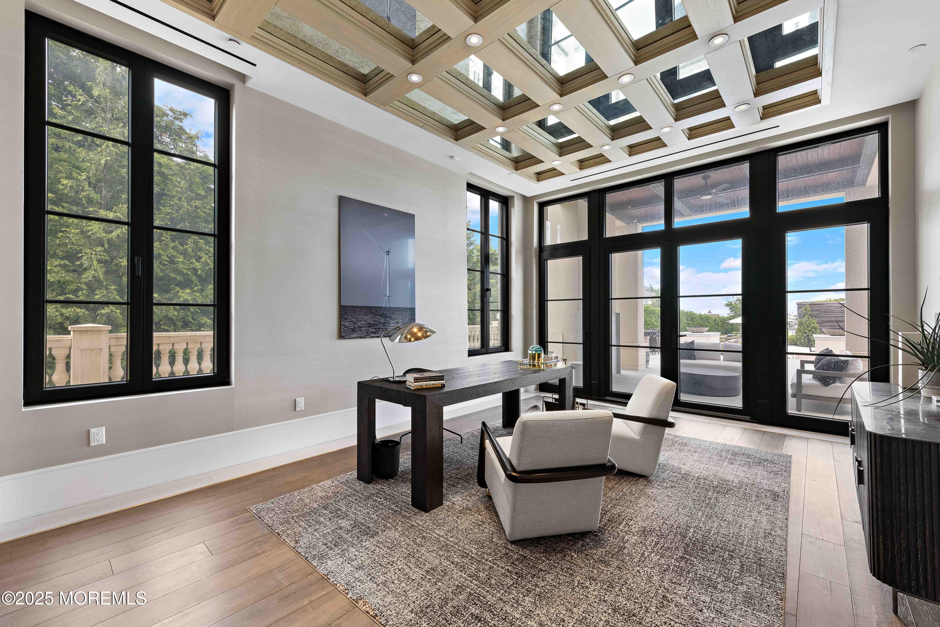 27 Ward Avenue Rumson, NJ 07760 - Photo 23 of 71 a living room with furniture and a floor to ceiling window
