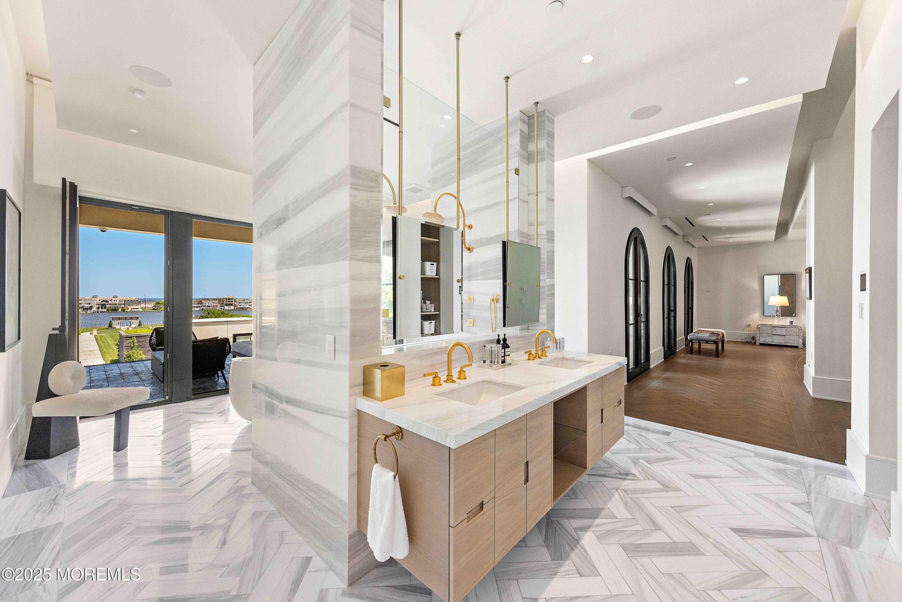 27 Ward Avenue Rumson, NJ 07760 - Photo 27 of 71 a large bathroom with a double vanity sink and a mirror