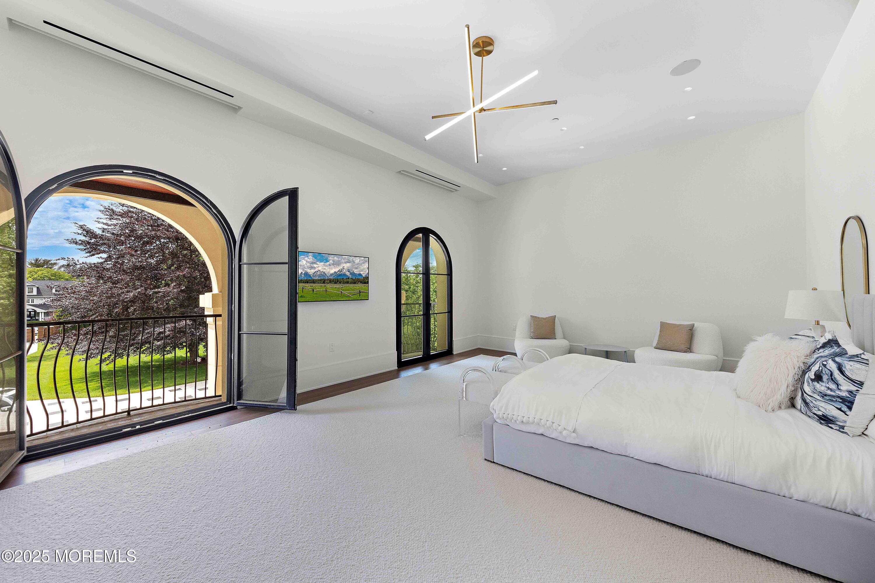 27 Ward Avenue Rumson, NJ 07760 - Photo 36 of 71 a bedroom with a bed and a large window