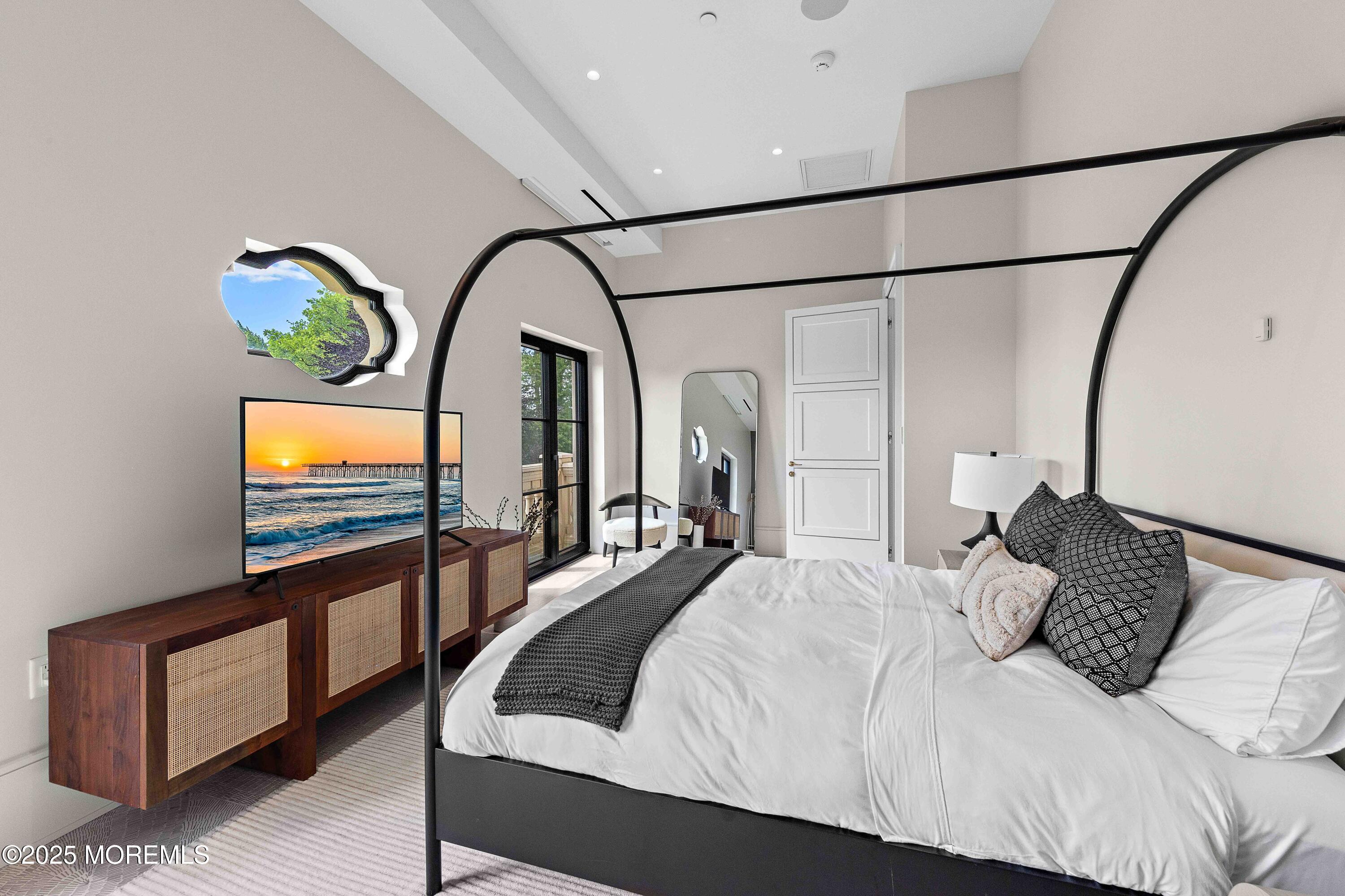 27 Ward Avenue Rumson, NJ 07760 - Photo 41 of 71 a bedroom with a bed a rug and a painting on the wall