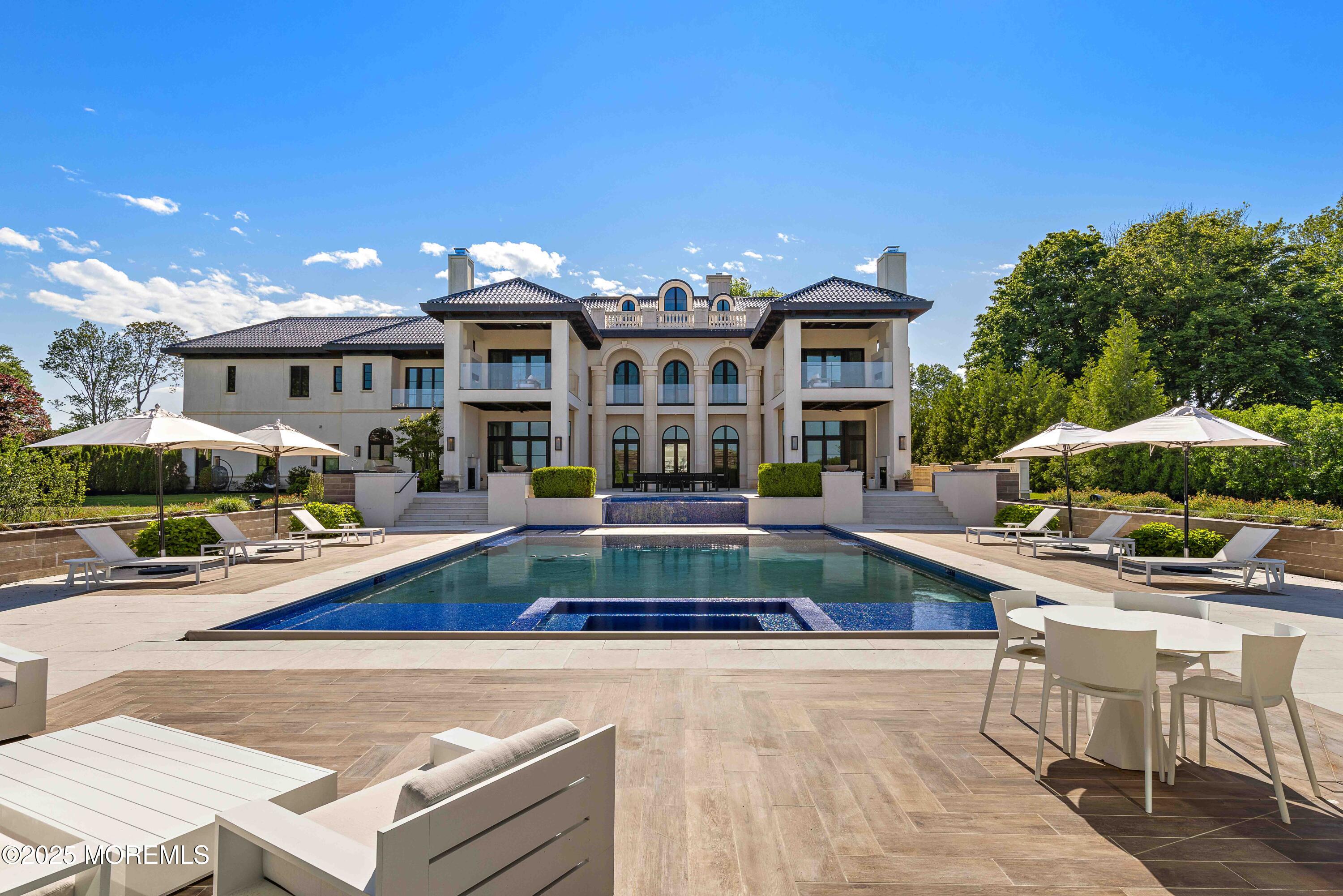 27 Ward Avenue Rumson, NJ 07760 - Photo 53 of 71 a view of a house with swimming pool and furniture