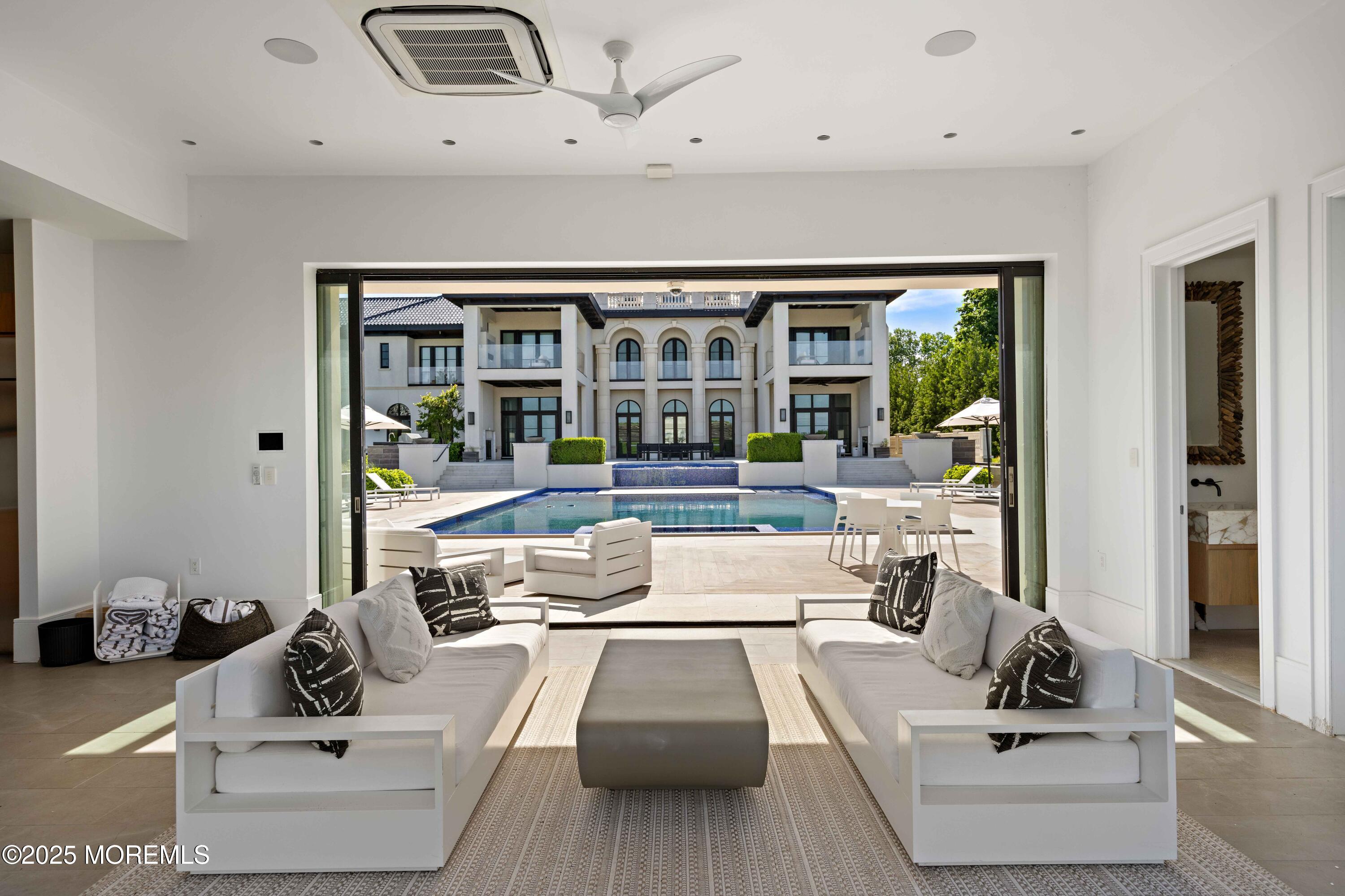 27 Ward Avenue Rumson, NJ 07760 - Photo 60 of 71 a living room with furniture and floor to ceiling window