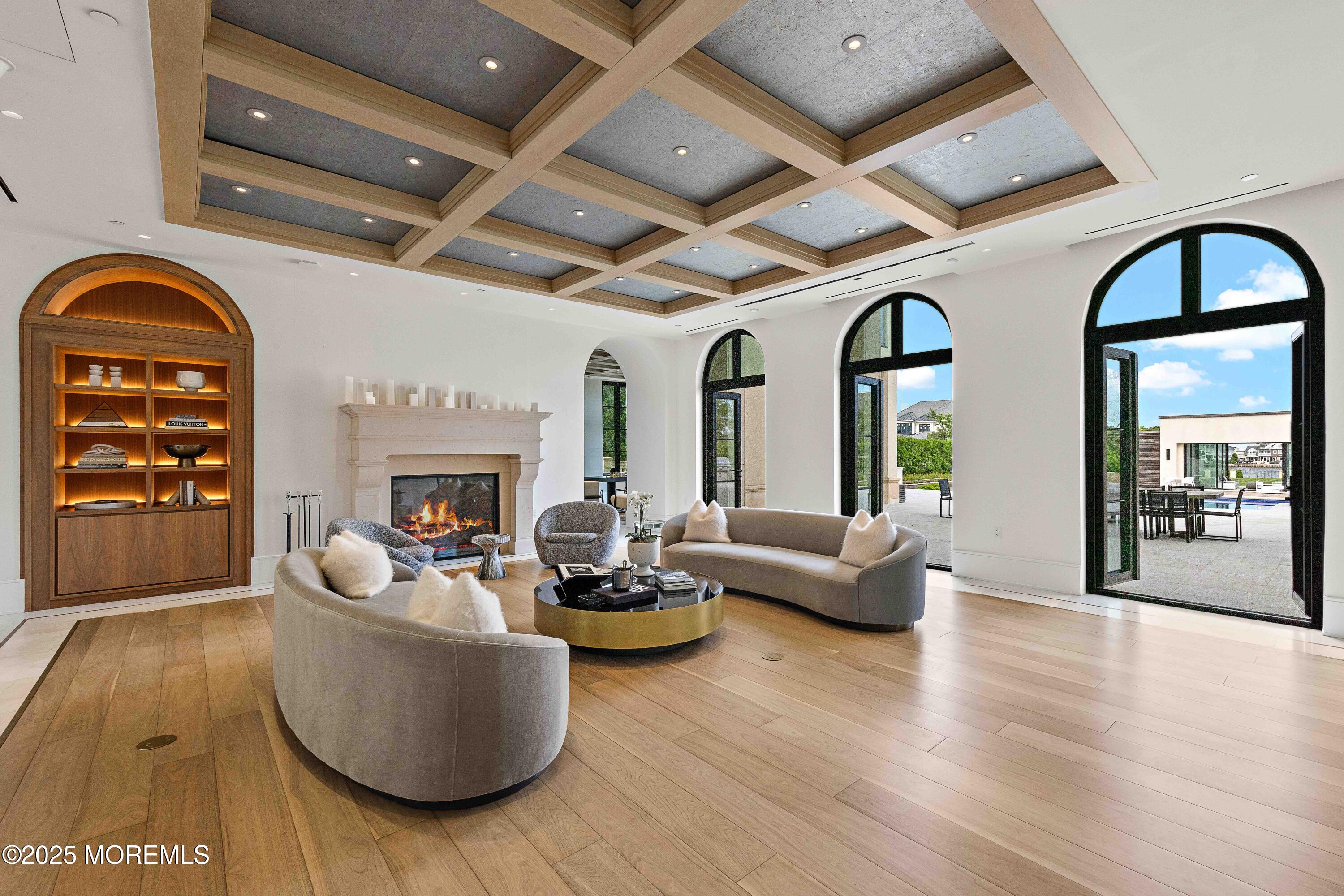 27 Ward Avenue Rumson, NJ 07760 - Photo 7 of 71 a living room with furniture a fireplace and a flat screen tv