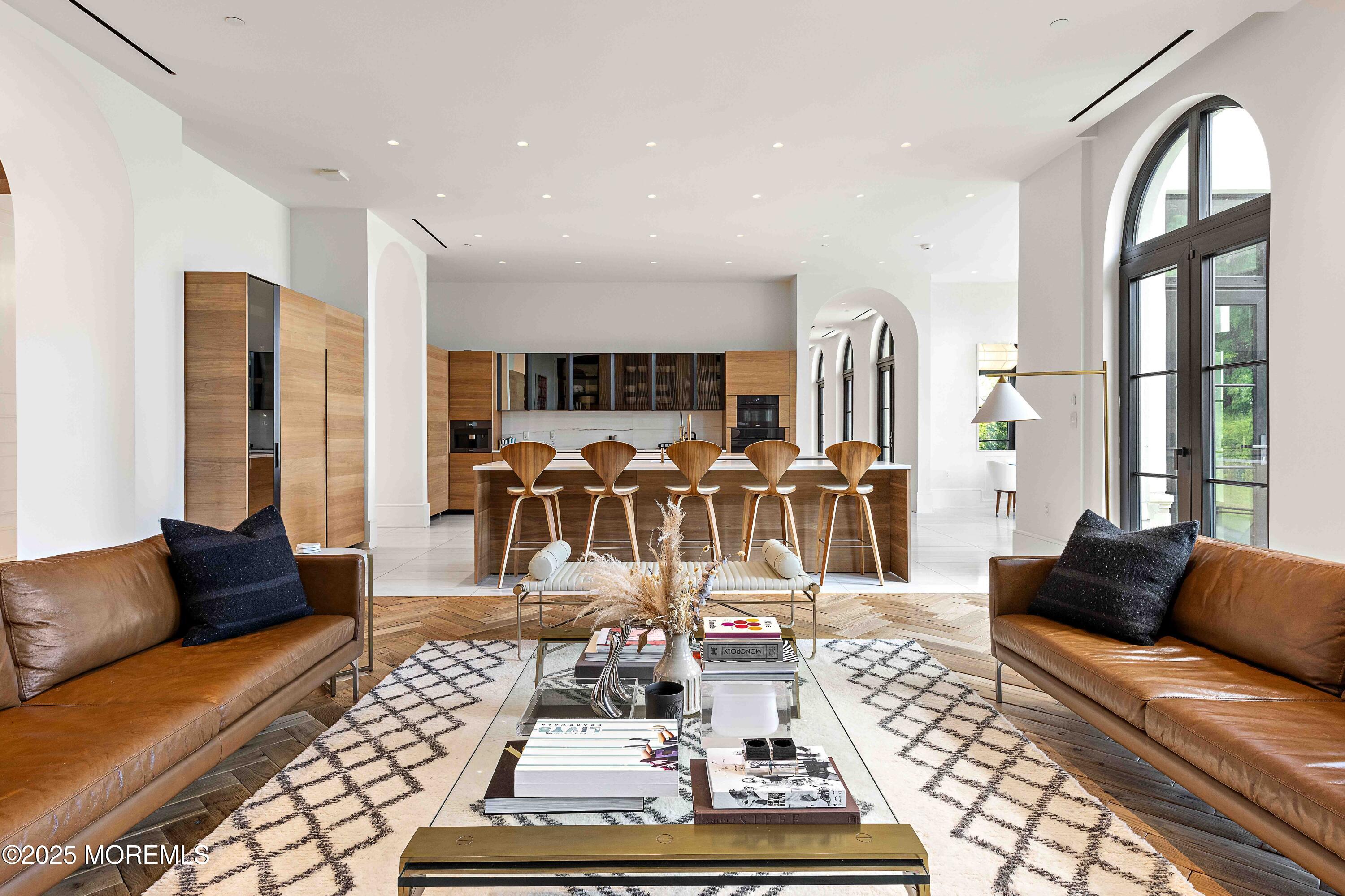 27 Ward Avenue Rumson, NJ 07760 - Photo 10 of 71 a living room with furniture a rug kitchen view and a large window