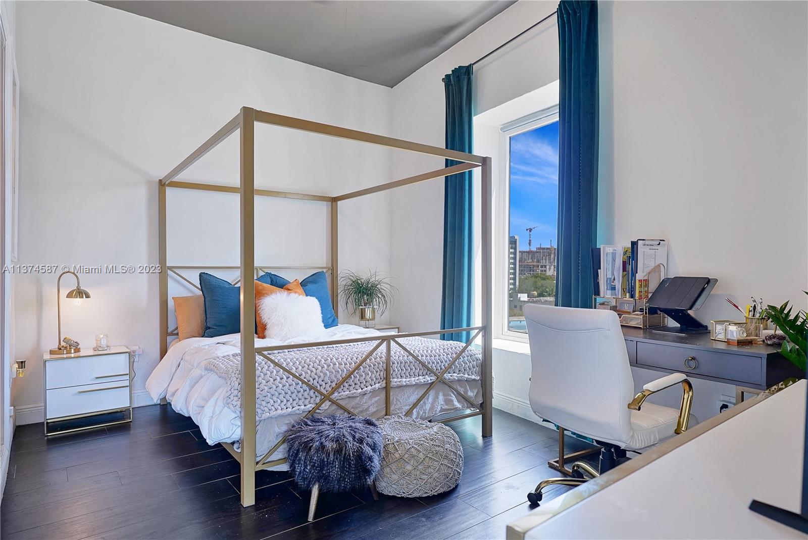 10 Southwest South River Drive, Unit 703 Miami, FL 33130 - Photo 24 of 47 a bedroom with a bed window and a desk