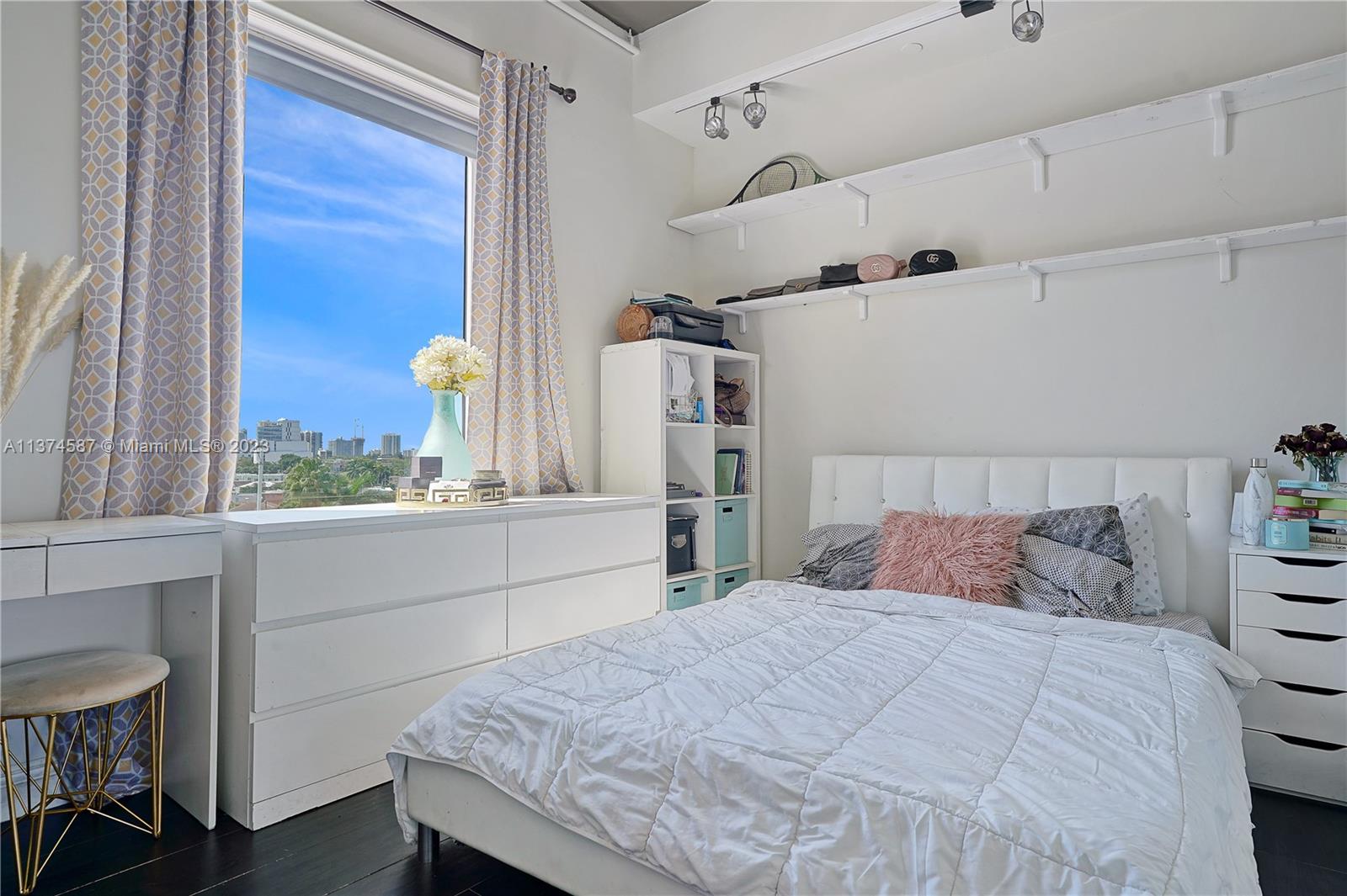 10 Southwest South River Drive, Unit 703 Miami, FL 33130 - Photo 29 of 47 a bedroom with a bed and a window