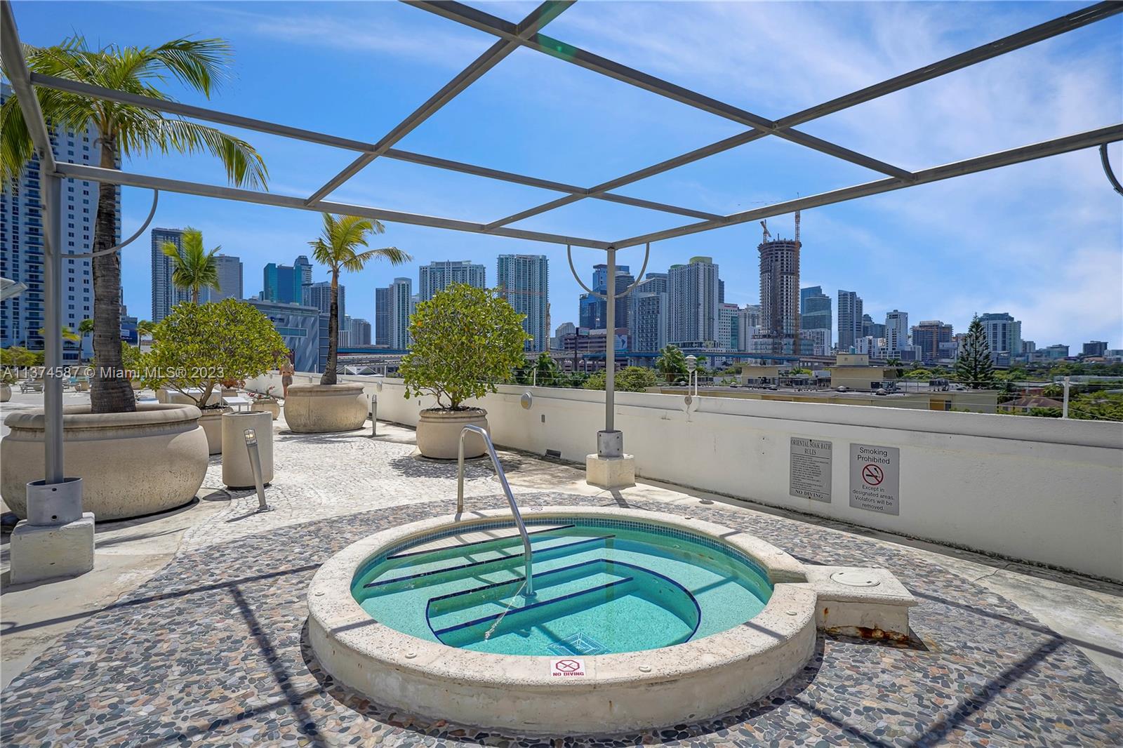 10 Southwest South River Drive, Unit 703 Miami, FL 33130 - Photo 36 of 47 a kitchen with a table and chairs
