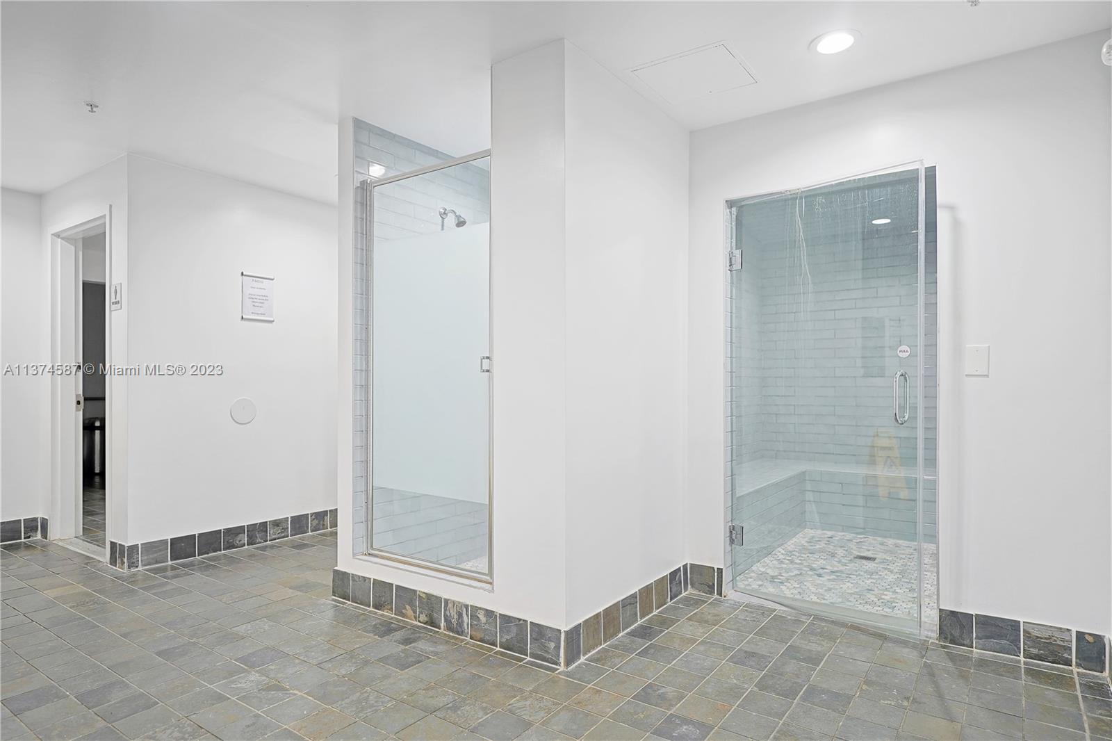 10 Southwest South River Drive, Unit 703 Miami, FL 33130 - Photo 40 of 47 a view of a bathroom with shower