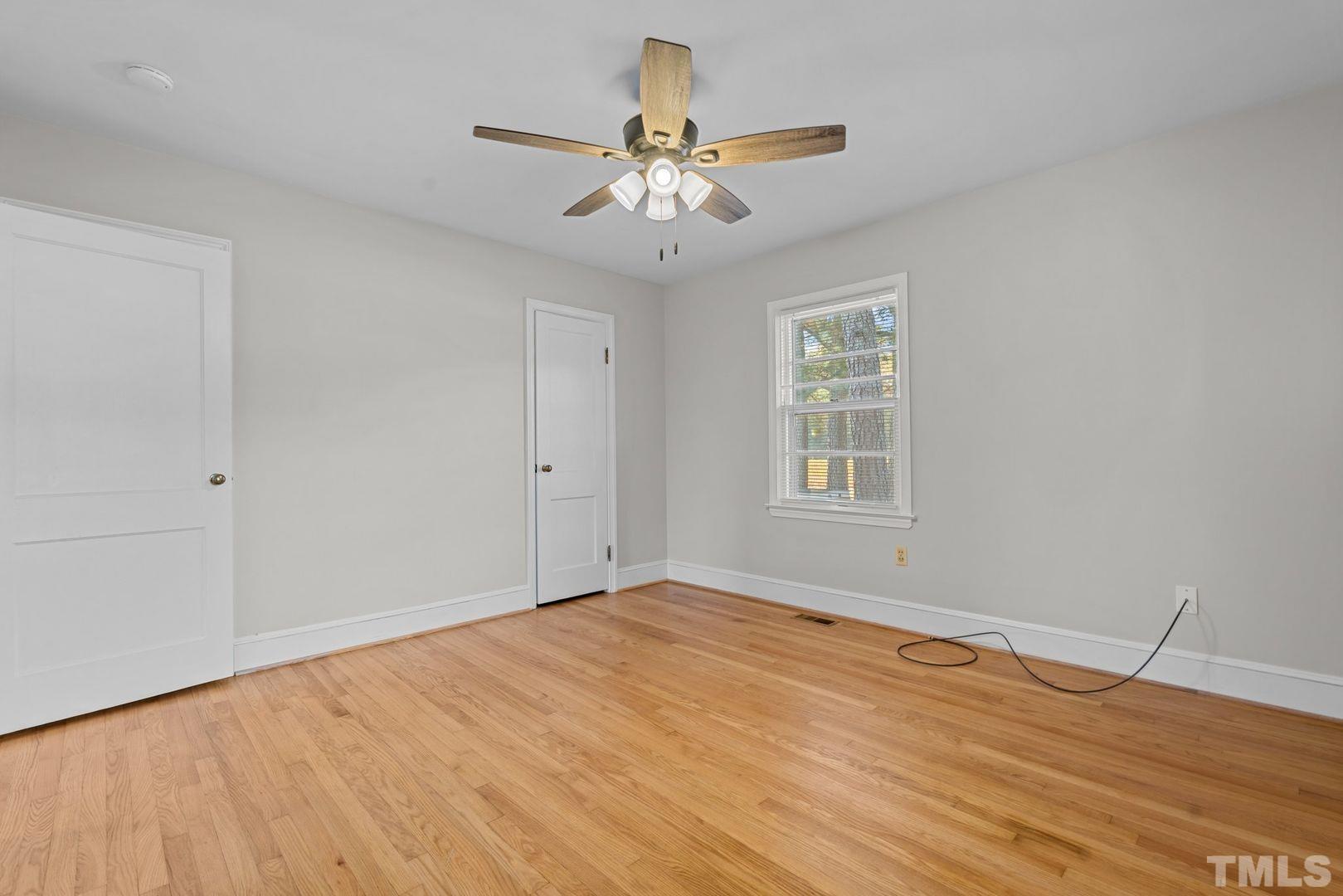 6198 Highway 401 Bunnlevel, NC 28323 - Photo 26 of 33 a view of empty room with wooden floor and fan