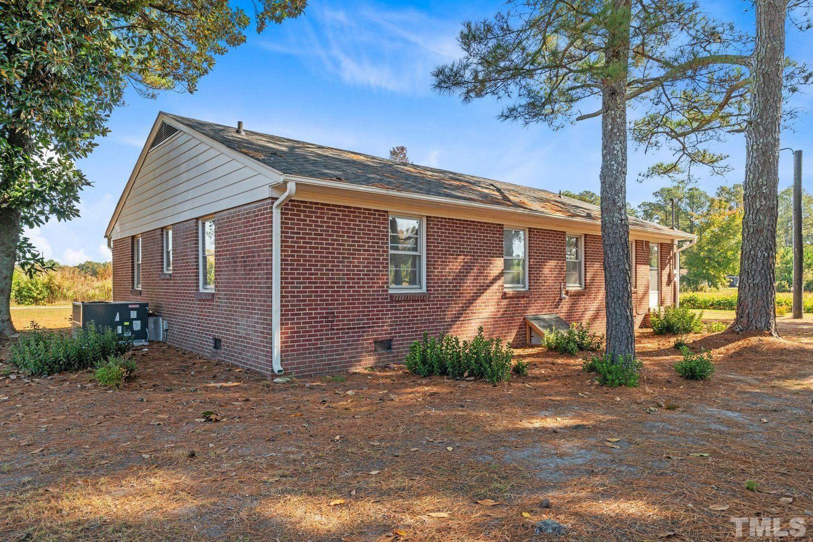 6198 Highway 401 Bunnlevel, NC 28323 - Photo 28 of 33 a view of a house with a yard