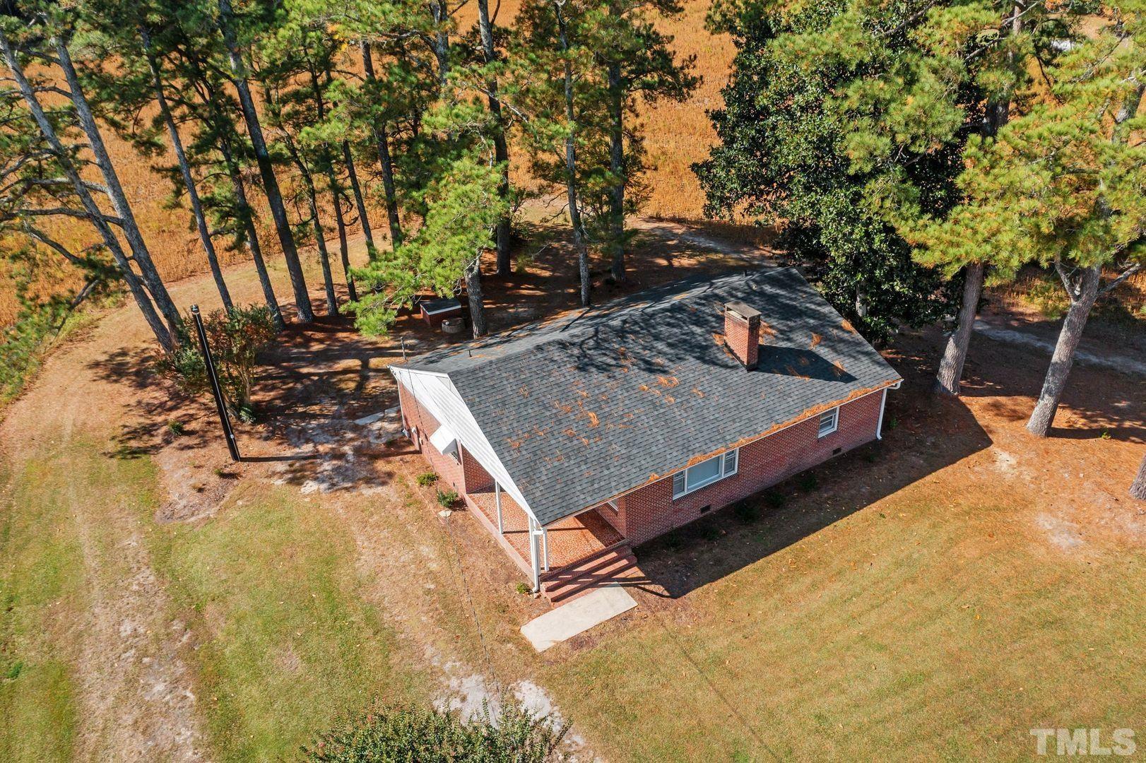 6198 Highway 401 Bunnlevel, NC 28323 - Photo 31 of 33 a view of a backyard with chairs