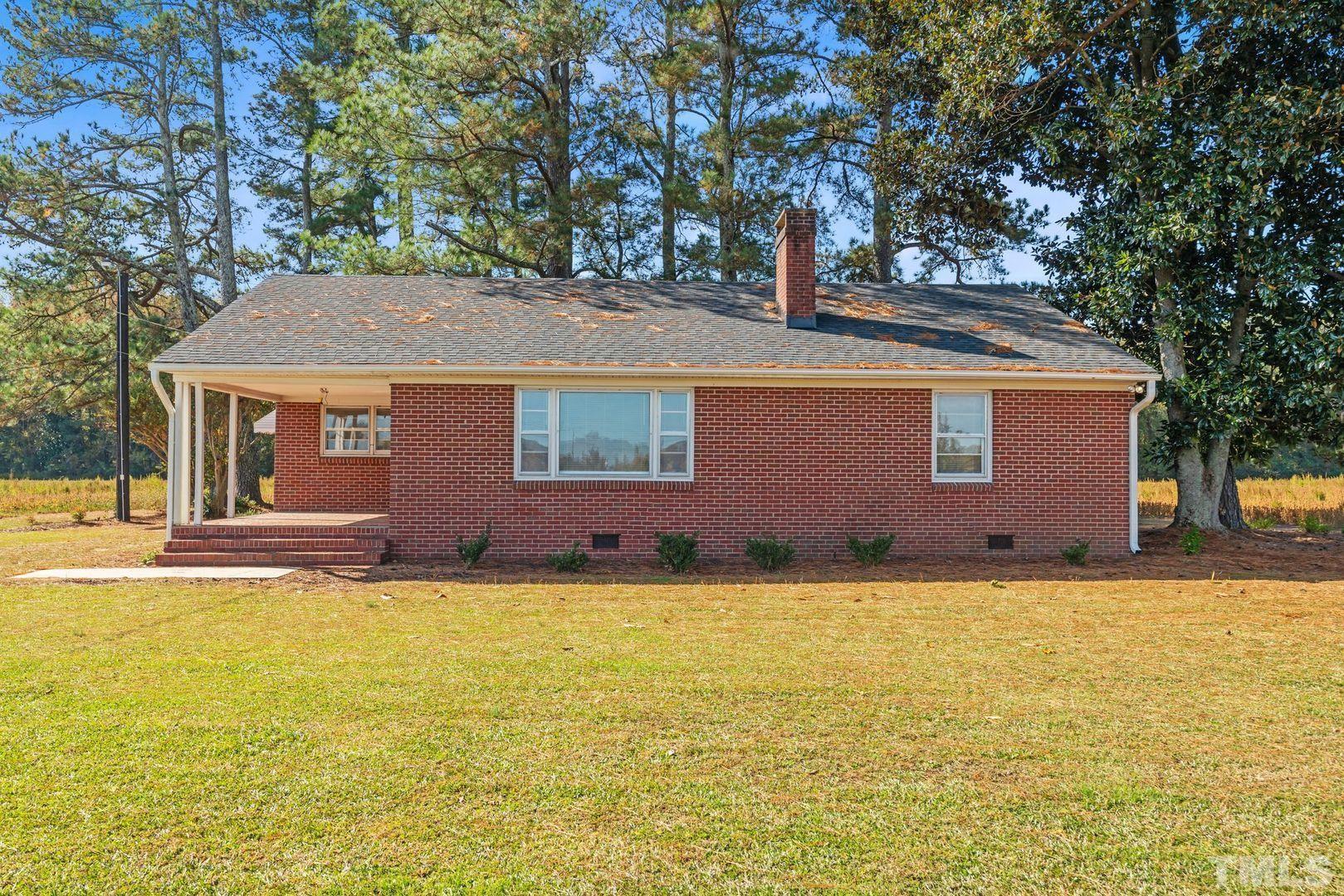 6198 Highway 401 Bunnlevel, NC 28323 - Photo 32 of 33 a view of pool with a house in the background