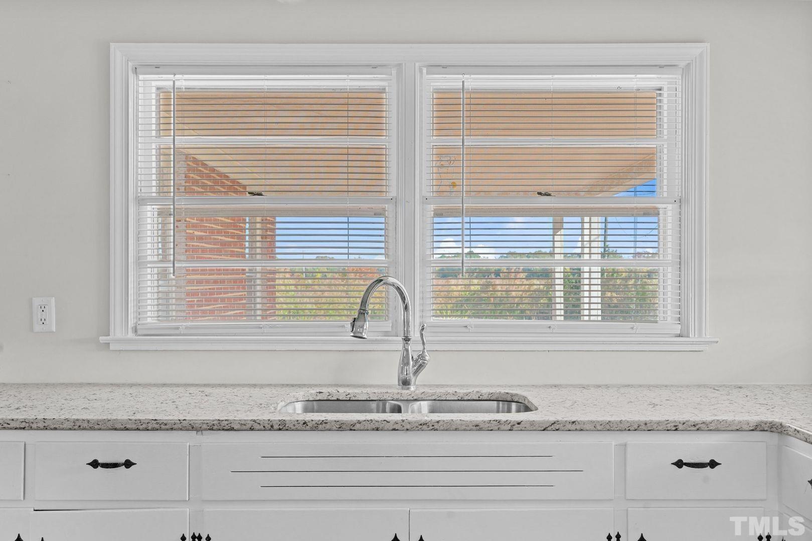 6198 Highway 401 Bunnlevel, NC 28323 - Photo 10 of 33 a close view of a granite countertop tub and utility