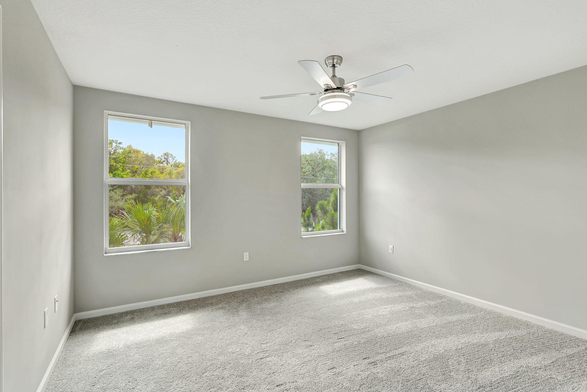 5694 Southeast Edgewater Circle Stuart, FL 34997 - Photo 12 of 22 a view of an empty room with a window