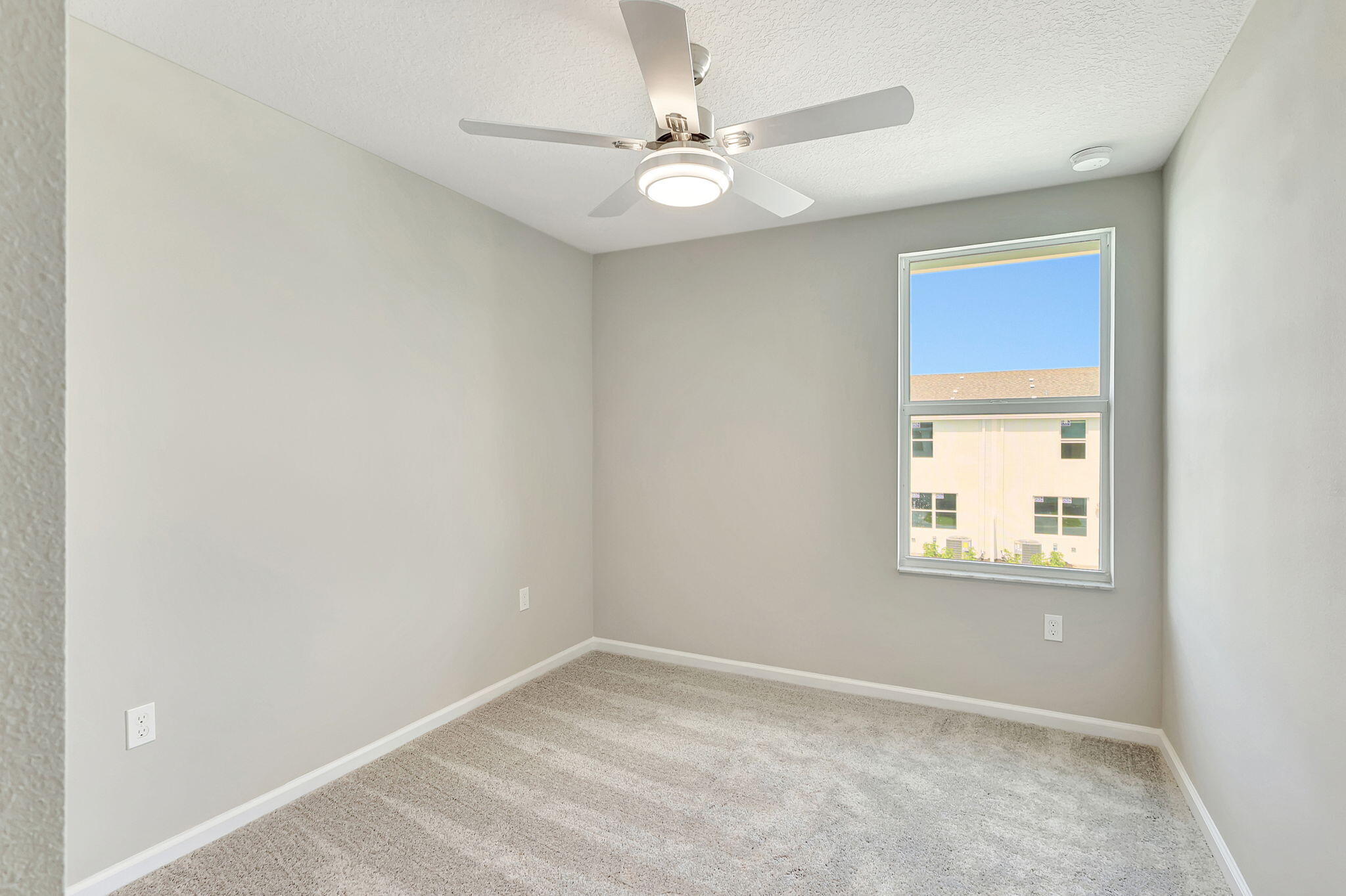 5694 Southeast Edgewater Circle Stuart, FL 34997 - Photo 17 of 22 an empty room with a window