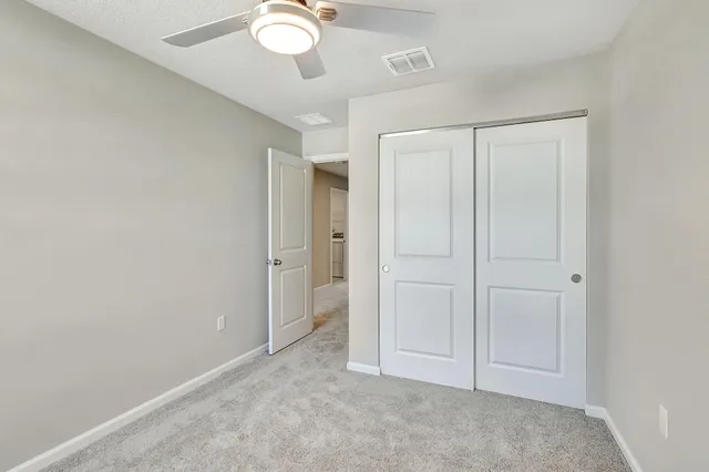 an empty room with closet area