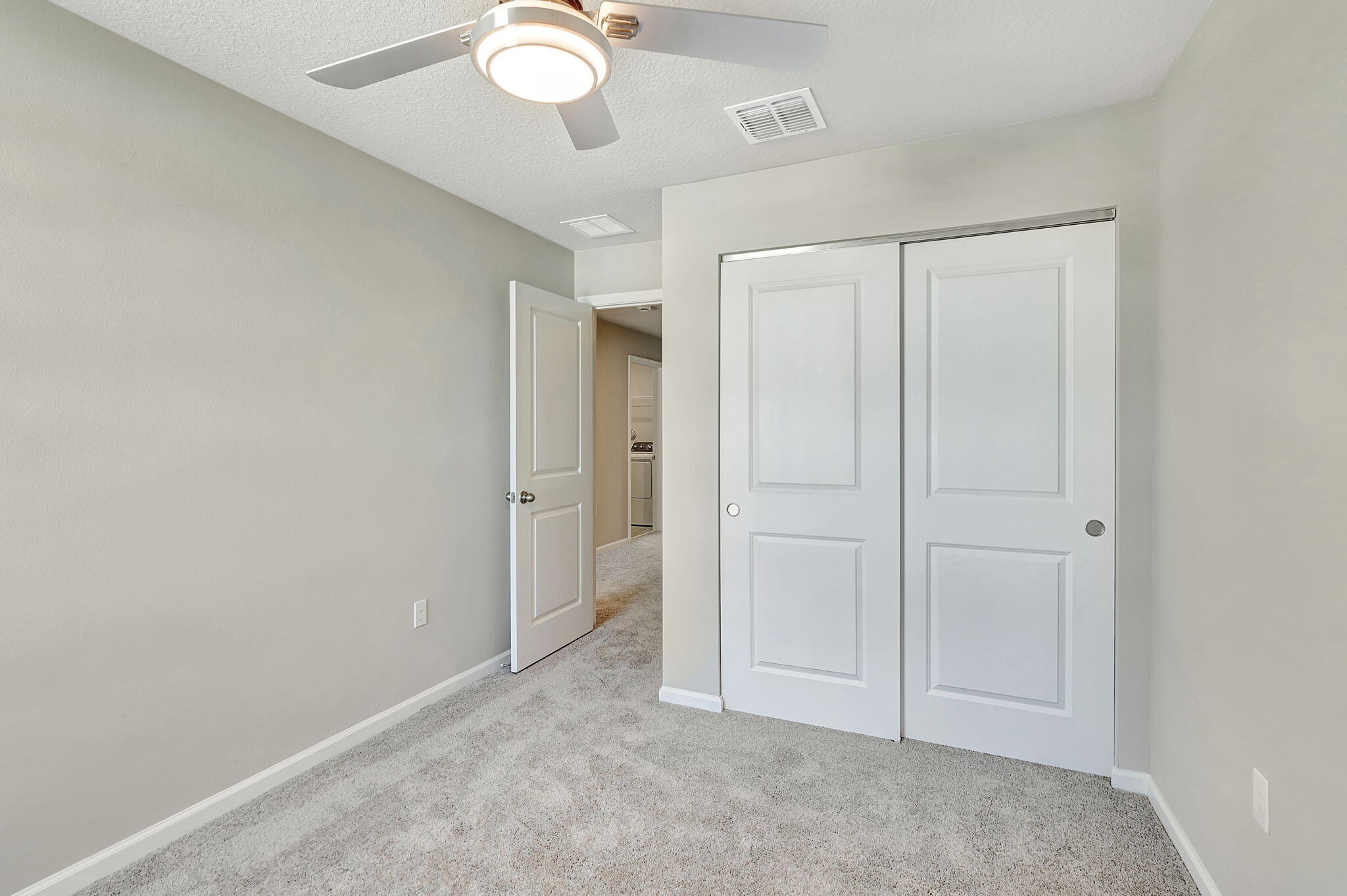 5694 Southeast Edgewater Circle Stuart, FL 34997 - Photo 18 of 22 an empty room with closet area