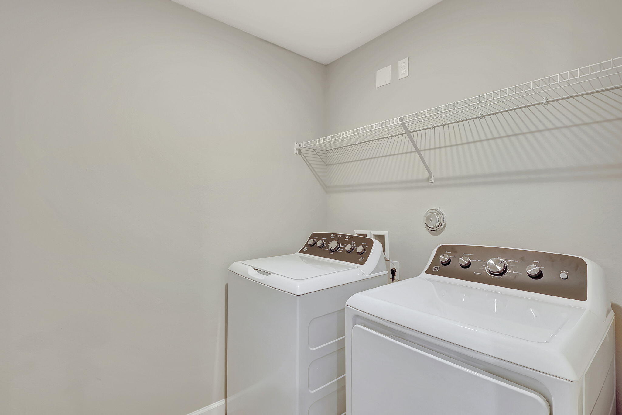 5694 Southeast Edgewater Circle Stuart, FL 34997 - Photo 21 of 22 a utility room with dryer and washer