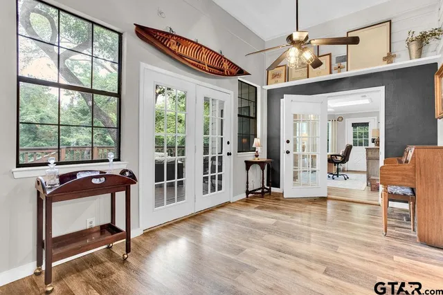 a view of a livingroom with furniture window and wooden floor