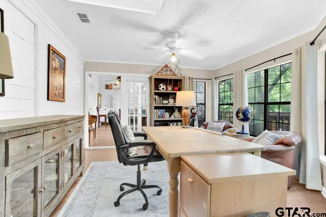 a view of kitchen island a sink and a refrigerator