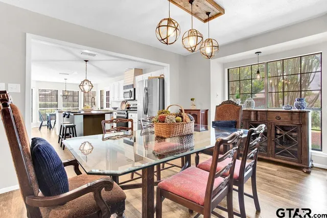 a view of a dining room with furniture window and wooden floor
