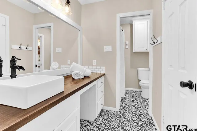 a bathroom with a shower and a toilet