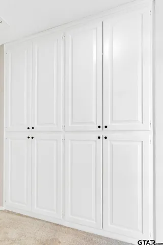 a balcony with wooden floor and outdoor seating