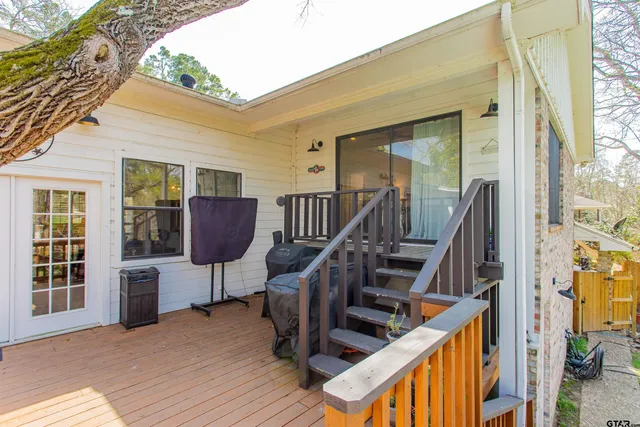 a view of a wooden house with a yard