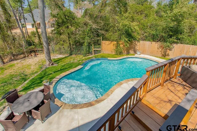 a view of a backyard with sitting area