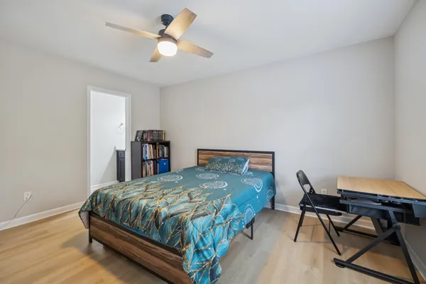 a bedroom with a bed and a table in it