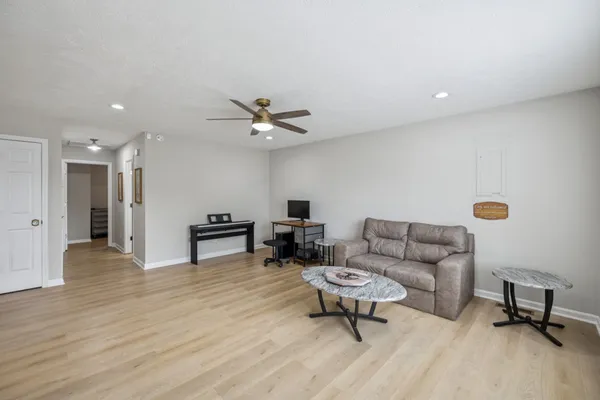 a living room with furniture and a table
